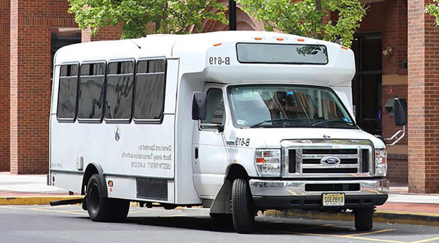 free student shuttle in front of camden campus